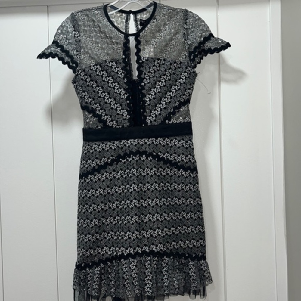 Few moda new york cocktail dress size small. Lace and form fitting . NWT